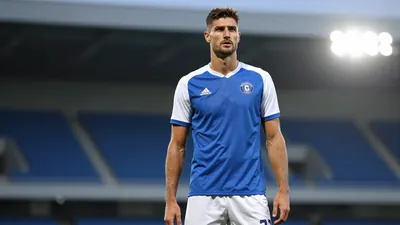 Milton Keynes Dons midfielder Liam Kelly's transfer to Peterborough United is in doubt as MK Dons boss Paul Warne rejects...